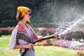 Woman watering the flowers