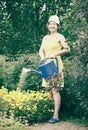 Woman watering flowers Royalty Free Stock Photo