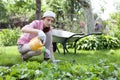 woman watering the garden bed