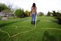 Woman is watering grass Royalty Free Stock Photo