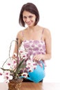 Woman watering orchid