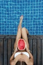 Woman with watermelon poolside Royalty Free Stock Photo