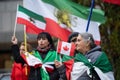 Woman Waves Canada Flag At Rally for the People of Iran in Toronto