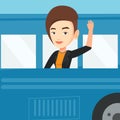 Woman waving hand from bus window.