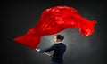 Woman waving red flag . Mixed media Royalty Free Stock Photo