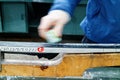 A woman waxing cross country skis before going out ski-ing Royalty Free Stock Photo