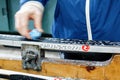 A woman waxing cross country skis before going out ski-ing Royalty Free Stock Photo