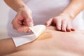 Woman Waxing Man`s Chest With Wax Strip Royalty Free Stock Photo