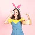 Woman wear bunny ear and hold easter egg cover eye Royalty Free Stock Photo