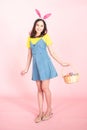 Woman wear bunny ears hold easter eggs basket Royalty Free Stock Photo