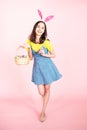 Woman wear bunny ears hold easter eggs basket Royalty Free Stock Photo