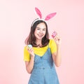 Woman wear bunny ears hold easter eggs basket Royalty Free Stock Photo