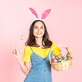 Woman wear bunny ears hold easter eggs basket Royalty Free Stock Photo