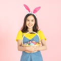 Woman wear bunny ears hold easter eggs basket Royalty Free Stock Photo