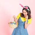 Woman wear bunny ears hold easter eggs basket Royalty Free Stock Photo