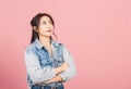 Woman wear denim standing her smile confidence with crossed arms