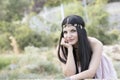 Woman wear flower headpiece and pink dress