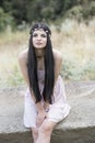 Woman wear flower headpiece and pink dress