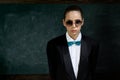 Woman wear masculine clothes tuxedo bow tie and eyeglasses. Sunglasses formal style. Girl formal jacket suit and