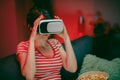 Woman wear VR headset playing video game. Woman relaxing playing video games using vr headset. Caucasian female gamer. Royalty Free Stock Photo