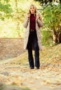 Woman wear warm grey jacket. Jacket everyone should have. Puffer fashion trend concept. Girl fashionable blonde walk in