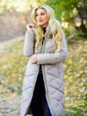 Woman wear warm grey jacket. Jacket everyone should have. Puffer fashion trend concept. Oversized jacket trend. Puffer