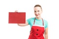 Woman wearing apron holding red cardboard Royalty Free Stock Photo
