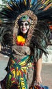 SAN ANTONIO, TEXAS - OCTOBER 29, 2017 - Woman wearing Aztec headdress and costume for Dia de Los Muertos/Day of the Dead celebrati