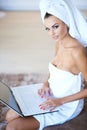 Woman Wearing Bath Towel Using Laptop Computer Royalty Free Stock Photo