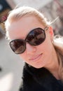 Woman wearing the big modern sunglasses.