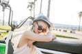 Woman wearing biking helmet. Close-up portrait of female cyclist in park.