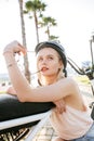 Woman wearing biking helmet. Close-up portrait of female cyclist in park. Royalty Free Stock Photo