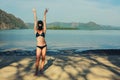 Woman wearing bikini and balaclava on beach Royalty Free Stock Photo