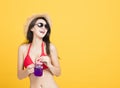 Woman wearing bikini and drinking tropical cocktail Royalty Free Stock Photo