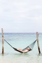 Woman Wearing Bikini And Sun Hat In Beach Hammock Royalty Free Stock Photo