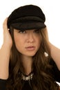 Woman wearing black hat with a somber look Royalty Free Stock Photo