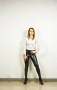 Woman wearing black leather pants and high heel shoes indoors Royalty Free Stock Photo