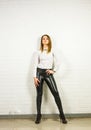 Woman wearing black leather pants and high heel shoes indoors Royalty Free Stock Photo