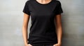 Woman wearing black t shirt mockup template for design print studio on light gray wall
