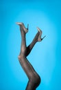Woman wearing black tights and stylish shoes on background, closeup of legs Royalty Free Stock Photo