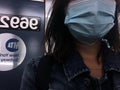 Woman Wearing Blue Face Mask on New York Subway Train Commute NYC