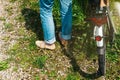 Woman wearing blue jeans denim near bike Royalty Free Stock Photo