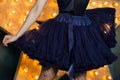 Woman wearing blue lace tutu skirt and mesh stockings posing ov Royalty Free Stock Photo