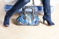 Woman wearing blue shoes and with handbag Royalty Free Stock Photo