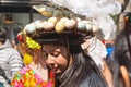 Woman wearing a bonnet featuring a lizard and its eggs at the Fifth Avenue Easter Parade