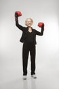 Woman wearing boxing gloves. Royalty Free Stock Photo