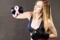 Woman wearing boxing gloves having pink ribbon Royalty Free Stock Photo