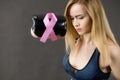 Woman wearing boxing gloves having pink ribbon Royalty Free Stock Photo