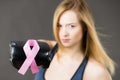 Woman wearing boxing gloves having pink ribbon Royalty Free Stock Photo