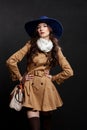 Woman wearing brown overcoat and cap blue